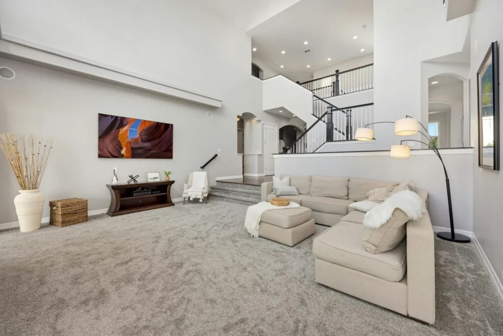 Elegant two-story living room with premium flooring installed by Beattie Flooring near Huntersville, NC